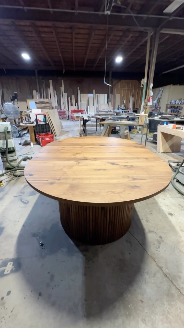 Round extendable walnut table